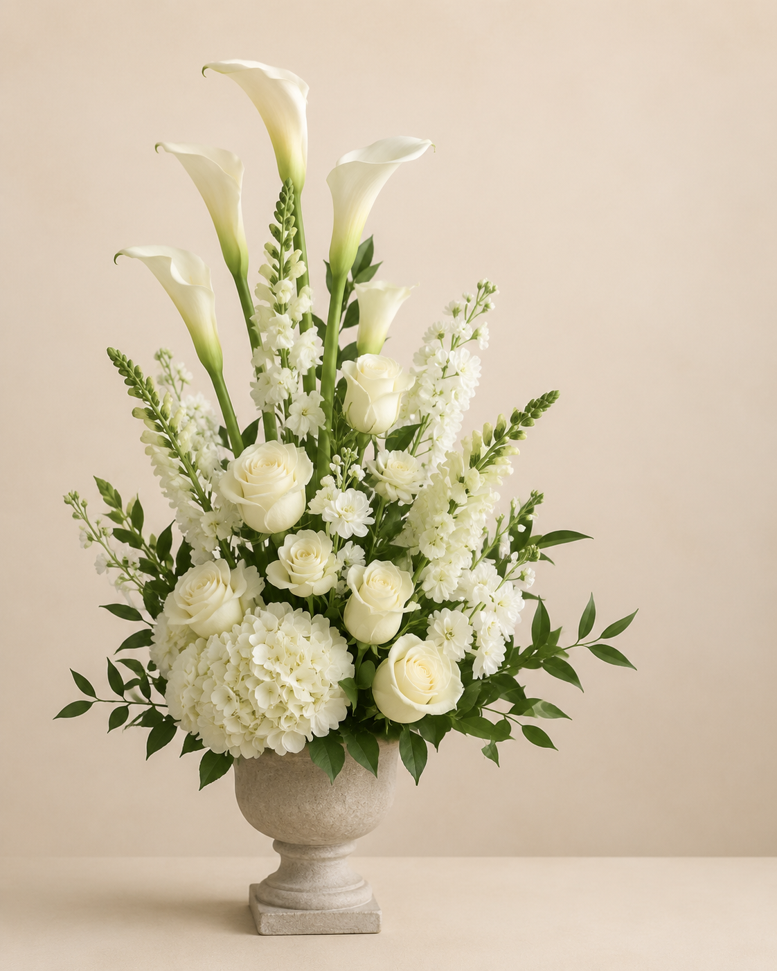 Alpine Calla Tribute in a matte stone pedestal vase