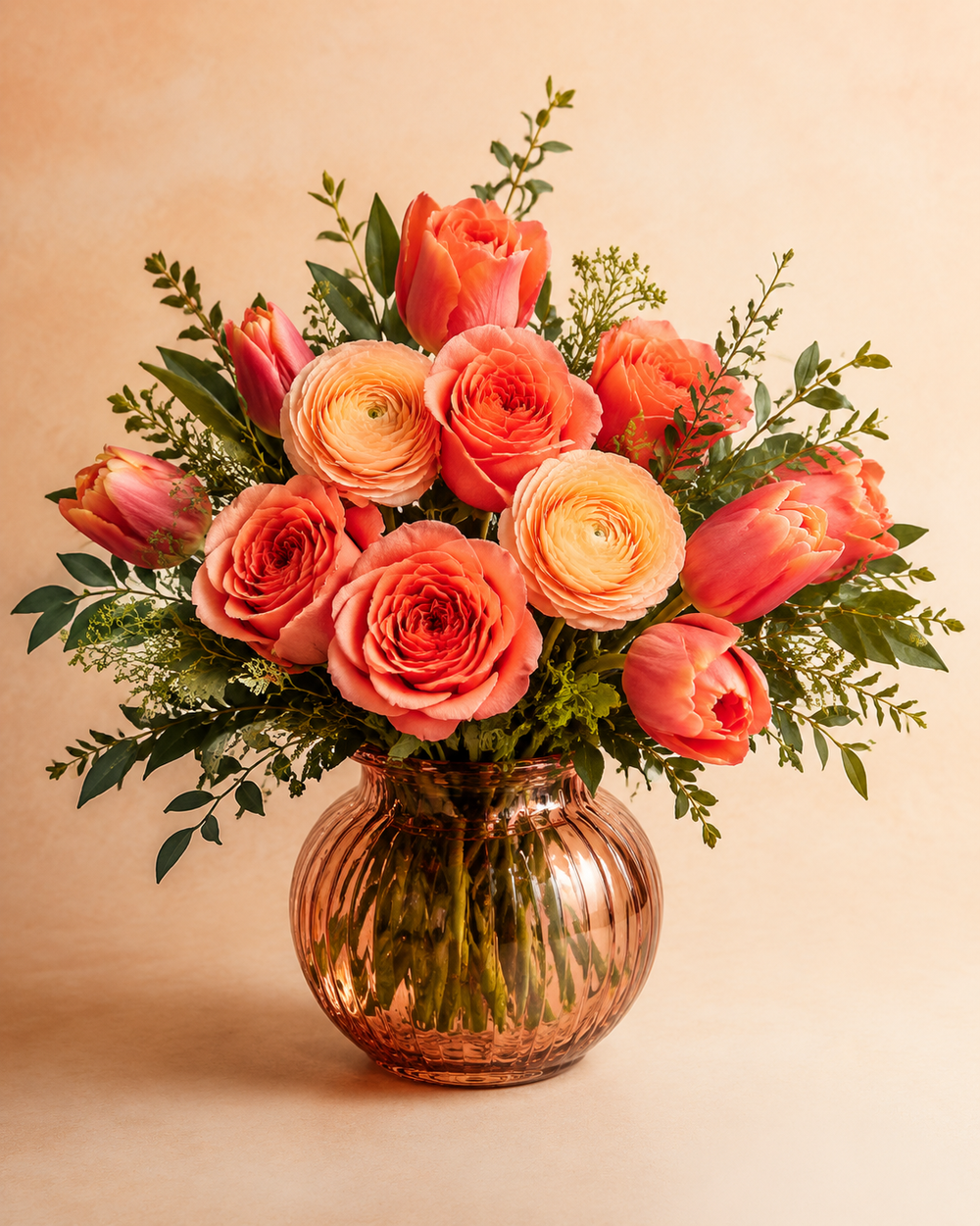 Candlelit Coral peach and coral flower arrangement