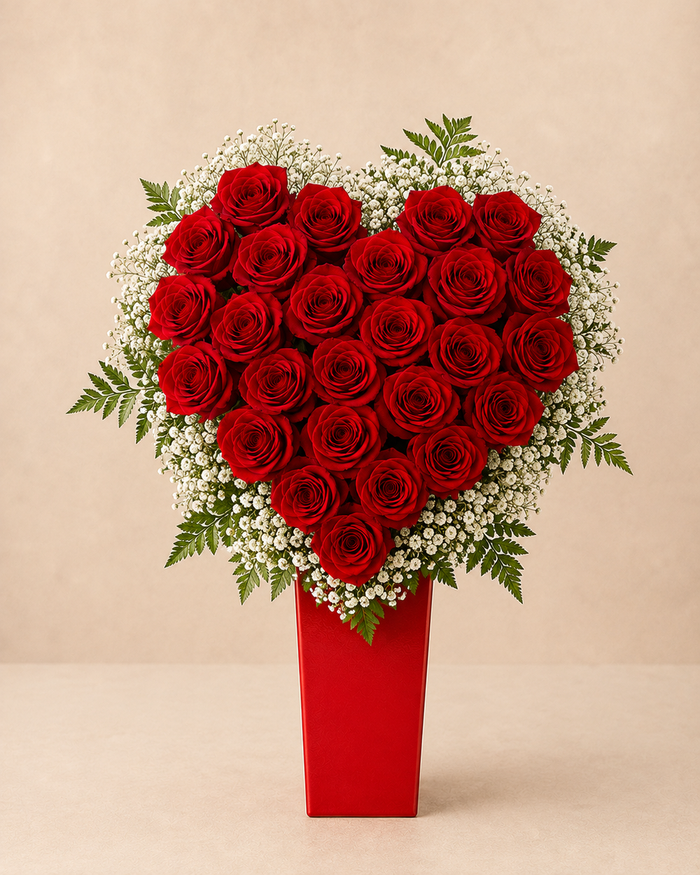 Crimson Heart Symphony Deluxe red rose heart with baby's breath and fern in tall red vase