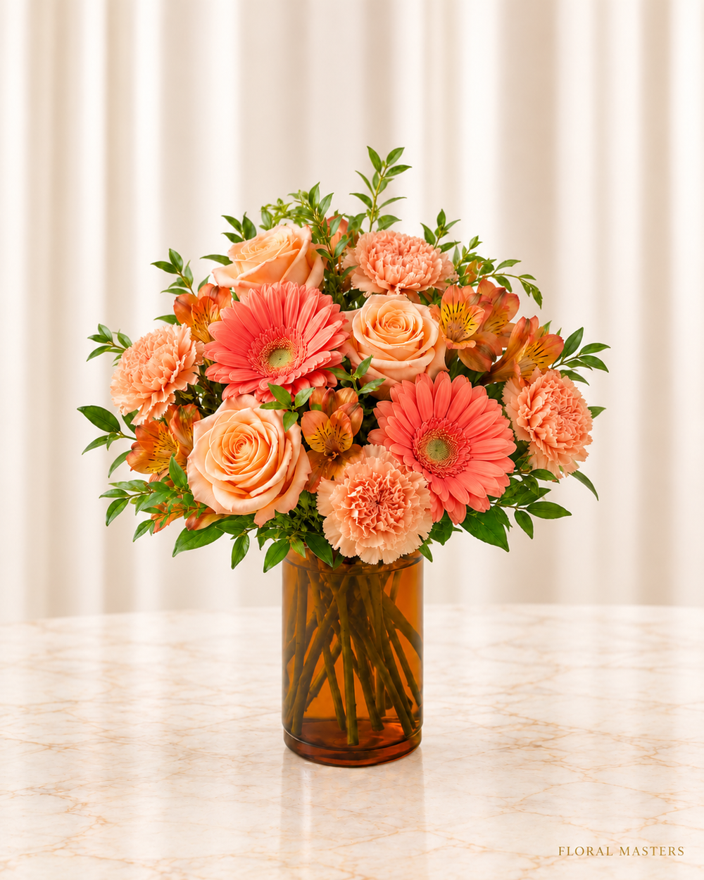 Peachtree Apricot Glow - Standard - peach roses, coral gerberas and peach carnations in an amber cylinder vase