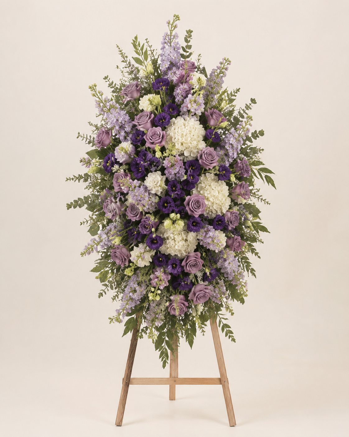 Lavender Bell Standing Spray with lavender roses, stock, lisianthus, and white hydrangeas