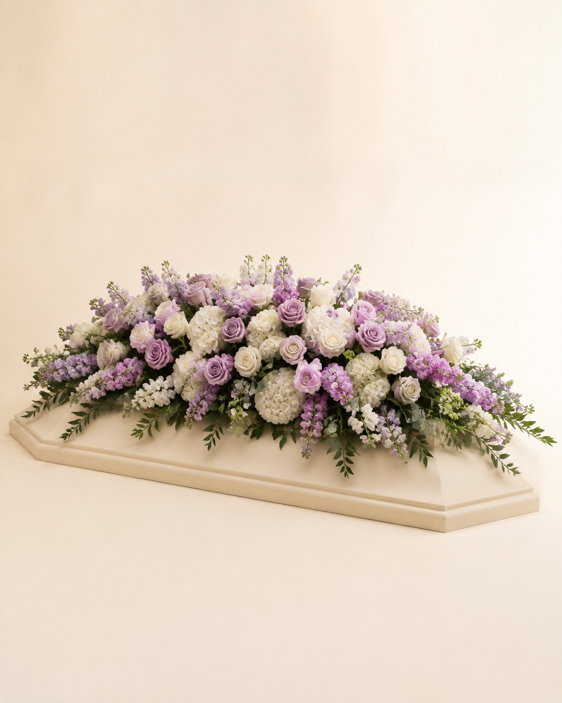 Lavender Dusk Full-Casket Spray with lavender and white roses, stock, and hydrangeas