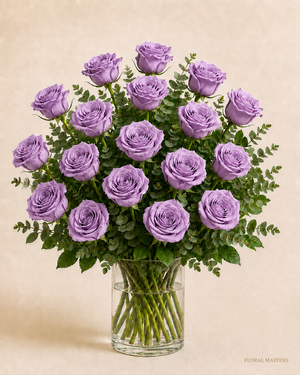 18 lavender roses with greenery in a clear glass vase