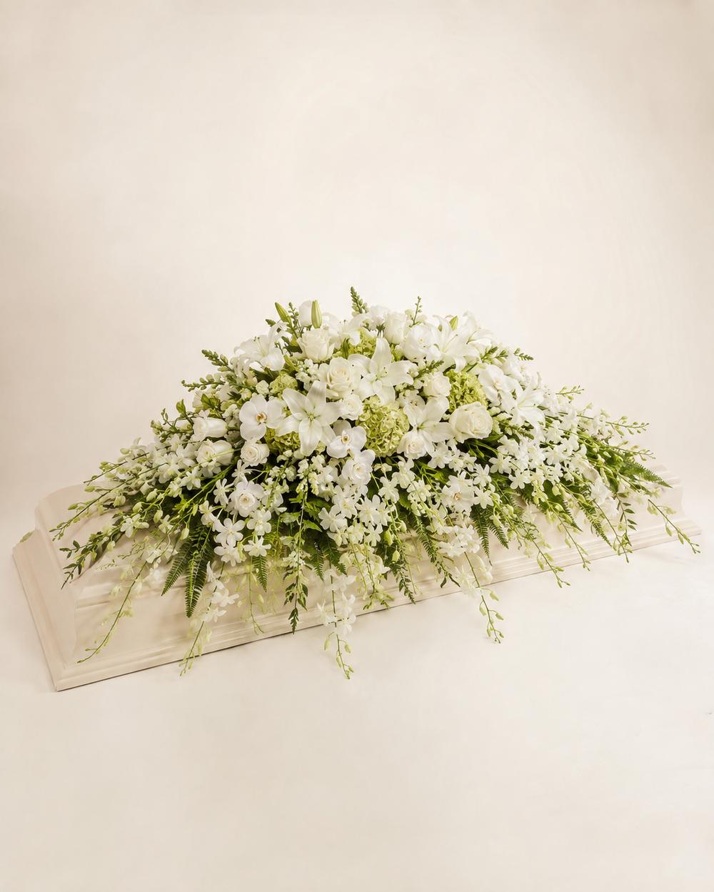 Orchid Veil Full-Casket Spray with white orchids, roses, lilies, and green hydrangeas