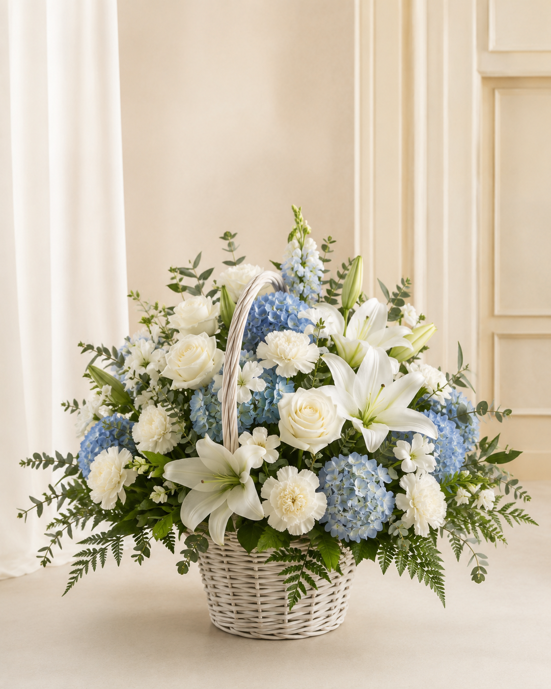 Blue and white sympathy basket with hydrangea lilies roses and white carnations