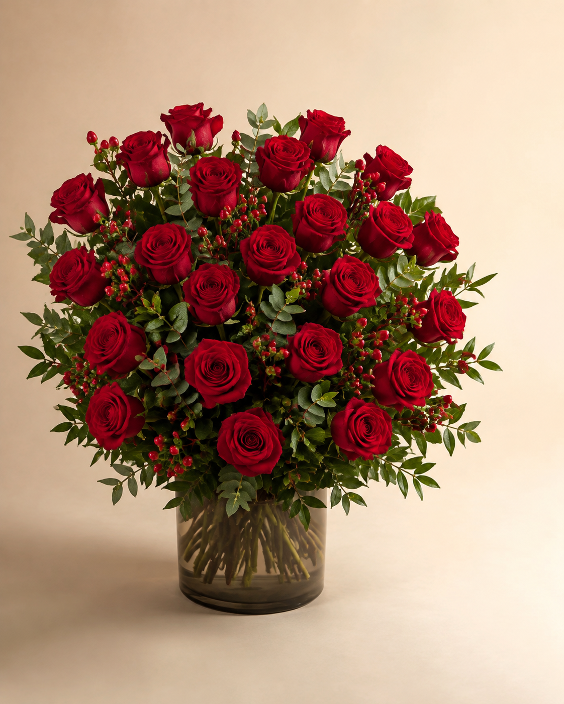 Twenty-Four at Twilight red roses in a smoke-gray glass vase