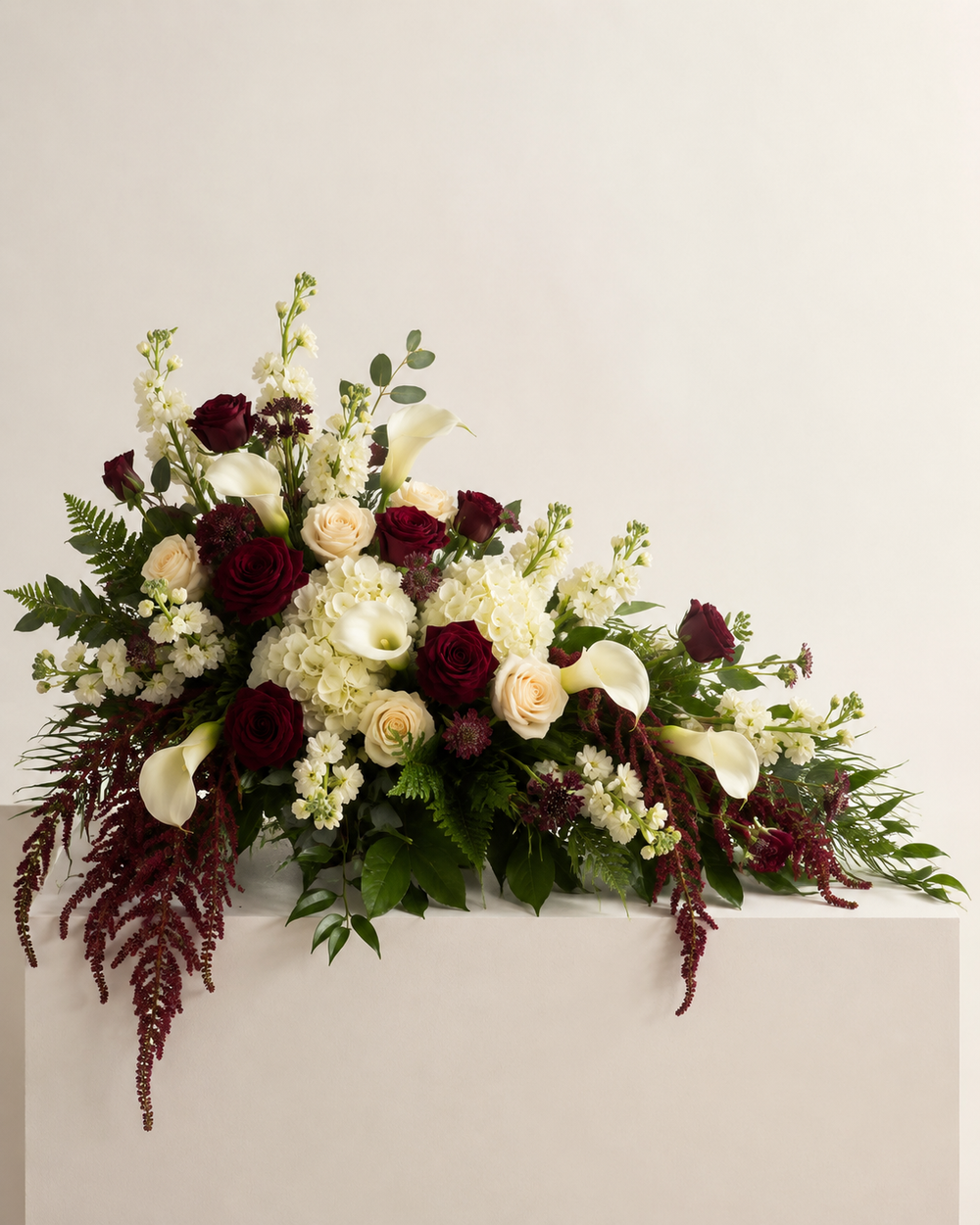 Velvet Honor half-casket floral spray