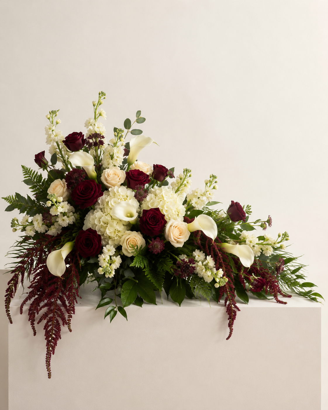 Velvet Honor half-casket floral spray