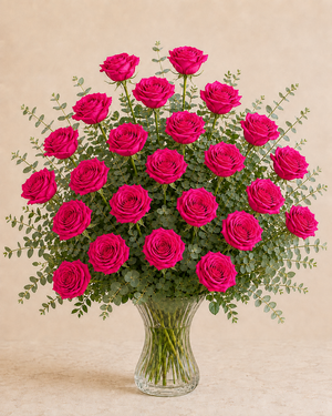 Exactly 24 hot pink roses in a clear fluted hourglass vase