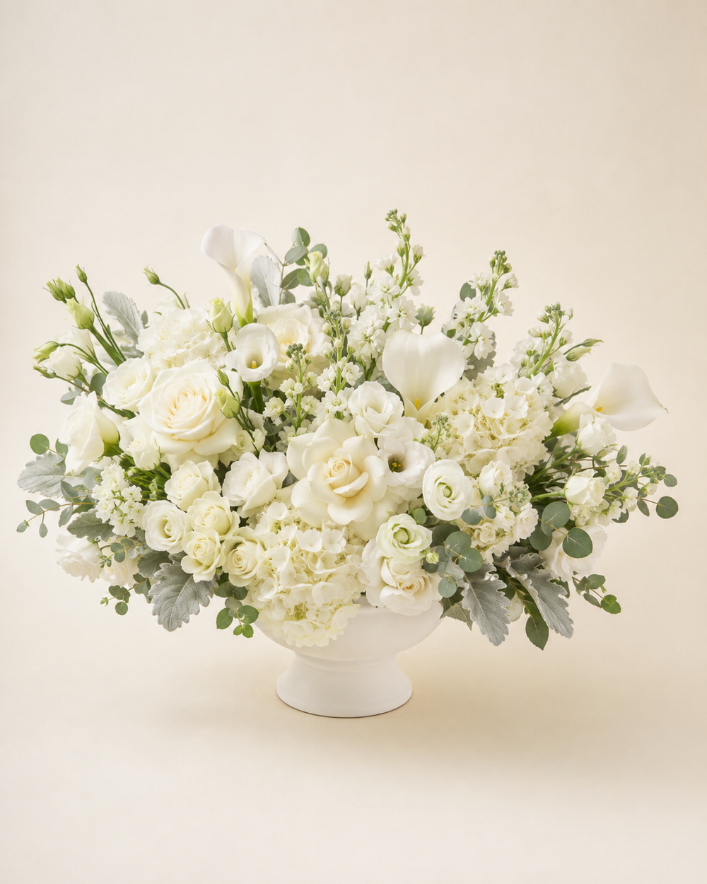 White Serenity all-white sympathy arrangement by Floral Masters